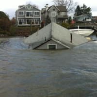 <p>A Fairfield Beach Road home is submerged by flooding after Hurricane Sandy.</p>