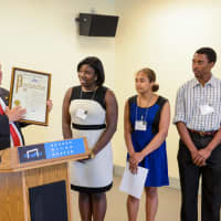 <p>Yonkers Mayor Mike Spano presenting Proclamation, with (from left) Aisha Yusuf, program coordinator and interim manager of Youth &amp; Family Programs; and Junior Docents Toni Jackson and Emanual Phillip.</p>