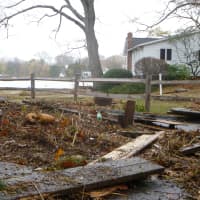 <p>Debris was strewn all over Binney Lane on Tuesday morning after Hurricane Sandy</p>