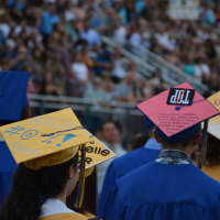 <p>Members of Mahopac High School&#x27;s class of 2015 come to commencement with mortarboard artwork.</p>