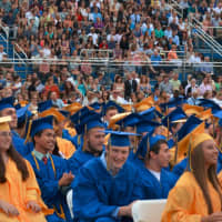 <p>Members of Mahopac High School&#x27;s class of 2015 sit for commencement. Onlookers in the bleachers are pictured in the background.</p>