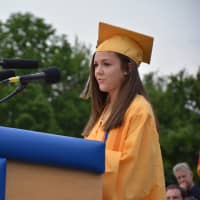 <p>Valedictorian Mikaela DiBello addresses the class of 2015.</p>