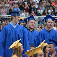 <p>Mahopac High School graduates who are entering the military stand for recognition.</p>