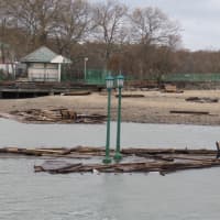 <p>A portion of the boardwalk at Playland Park in Rye floating in the Long Island Sound. </p>