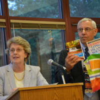 <p>Seven Bridges Interim Principal Michael Kirsch, previously Grafflin&#x27;s longtime principal, is given retirement gifts. Superintendent Lyn McKay is pictured to the left.</p>