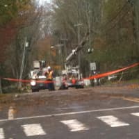 <p>Recovery crews in Darien block off Rings End Road, which sustained heavy flooding from Hurricane Sandy.</p>