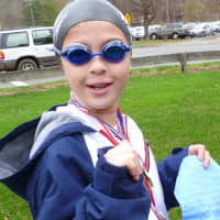 <p>Callie Judelson, 9, dressed up as Olympic gold medalist Missy Franklin. </p>