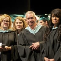 <p>Faculty members watch Saturday&#x27;s Yorktown High graduation ceremony at SUNY Purchase.</p>