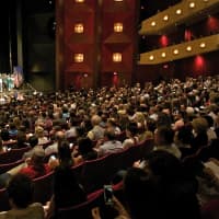 <p>Friends and family members fill the SUNY Purchase Performing Arts Theater for the Yorktown High graduation.</p>