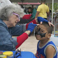 <p>Jeremy Munoz, 4, of Yonkers gets a Batman face painting.</p>