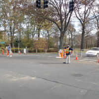 <p>The entrance to Rye Playland on Forest Avenue is closed Thursday, and workers redirect traffic.</p>