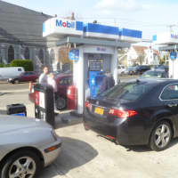 <p>Drivers fill their tanks at the Dobbs Ferry Mobil staion.</p>