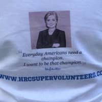 <p>A T-shirt advertises the website for Clinton volunteers. </p>