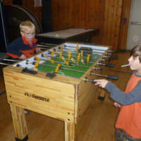 <p>Two Dobbs Ferry boys enjoy games at the Embassy Community Center.</p>