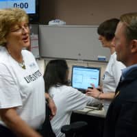 <p>County Executive Robert Astorino talks to volunteers at United Way&#x27;s 2-1-1 center in White Plains Thursday.</p>