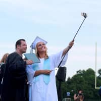 <p>Westlake High School graduate Shannon Frisbie takes a selfie with Principal Keith Schenker.</p>