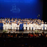 <p>The Class if 2015 assembles on stage.</p>