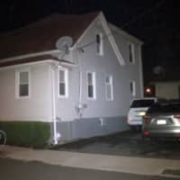 <p>The rear of this multi-family New Rochelle home was struck by a bullet that went through a window early on Monday night. </p>
