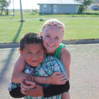 <p>Liz Morrissey and White Horse community resident Laken playing on Team 1&#x27;s last day at the reservation.</p>