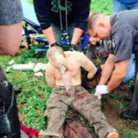 <p>Escaped killer David Sweat being treated from first responders after being shot Sunday.</p>