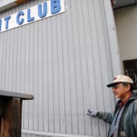<p>Croton Yacht Club board member Dennis Kooney points to the high water mark. </p>