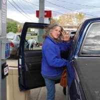 <p>Michelle Sludock of Wilton&#x27;s Georgetown section, has spent some of her days without power getting water to residents in need.</p>