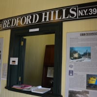 <p>Historical signage at booth window at the Bedford Hills train station.</p>
