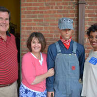<p>Left to right: Don Scott, Bea Rhodes and MaryAnn Carr pose for a photo next to a mannequin dressed in railroad working attire.</p>