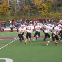 <p>Stefano Bicknese (#23) takes a handoff and follows his blockers in Somers&#x27; 28-14 win over Harrison in a Section 1 Class A Football Championship semifinal Saturday.</p>