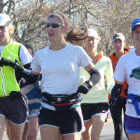 <p>Runners supporting the Connecticut Challenge cruise near the one mile mark in Sunday&#x27;s 26.2 mile run.</p>