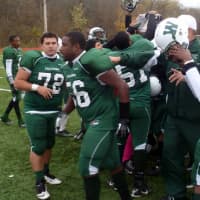 <p>The Woodlands High School football team celebrates its first section championship since 1993.</p>