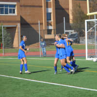 <p>Brenna Brown is congratulated by her teammates after scoring the first goal of the game Sunday. North Salem beat Blind Brook, 2-0 in a Section 1 Class B Girls Soccer Championship quarterfinal game.</p>
