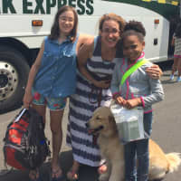 <p>Lindsay and Sarah Adrianowycz greet Kimberly Pena in Ridgefield and get ready to take her home to Katonah for swimming, kayaking and canoeing.</p>