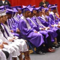 <p>Lincoln High School students wait patiently for their names to be called up on stage to receive their diplomas.</p>