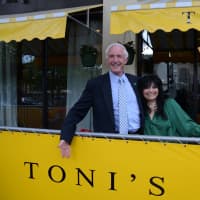 <p>Toni Sapienza, chef and owner of Tonis Tuscan Table, celebrates the opening of her downtown location with Mayor Bill Finch. </p>