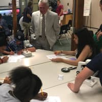 <p>Norwalk Mayor Harry Rilling visits with students in the Mayor&#x27;s Student Engineering and Science Program at the Maritime Aquarium.</p>