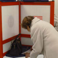 <p>Sylvia Woloshia casts her vote at White Plains High School Tuesday afternoon.</p>