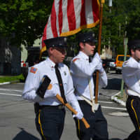 <p>Firefighters with a color guard march in Cold Spring&#x27;s Independence Day parade.</p>
