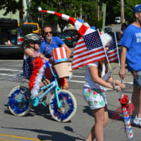 <p>Kids participate in Cold Spring&#x27;s Independence Day parade with patriotic decorations.</p>