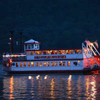 <p>A tour boat on the Hudson River shortly before a fireworks display in Cold Spring starts.</p>