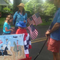 <p>The young artists made their own red, white and blue paintings for the parade. </p>