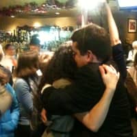 <p>Andres Bermudez-Hallstrom hugs his fiance after learning he edged out his Republican challengers for a seat on the Village of Mamaroneck Board of Trustees Tuesday.</p>