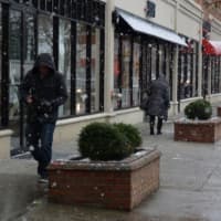 <p>Pedestrians in Fairfield&#x27;s Post Road shopping district brave the snow and winds Wednesday.</p>
