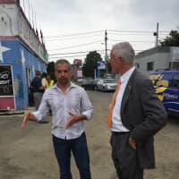 <p>Bridgeport Mayor Bill Finch (D) talks with business owner Rahman Hashimi  at the groundbreaking of Hashimi&#x27;s restaurant Monday afternoon.</p>