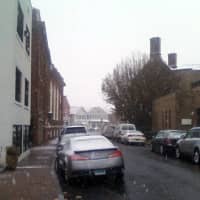 <p>Snow begins to cover cars parked along Church Lane in downtown Westport Wednesday. </p>
