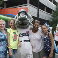 <p>Fans pose with one of the mascots at Tuesday&#x27;s block party.</p>