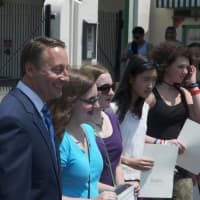 <p>Rob Astorino poses with students who met his ACE challenge Tuesday at Playland.</p>