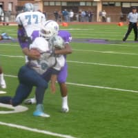 <p>The New Rochelle defense (in blue) has not allowed a point in the postseason.</p>