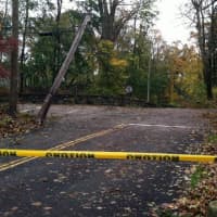 <p>A tree fell on a wire, closing this portion of Old Briarcliff Road at Central Drive West in Briarcliff during Hurricane Sandy. </p>