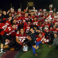 <p>The Somers High School football team celebrates its Section 1 Class A Championship.</p>